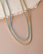 Round turquoise tennis necklace by Sami Jewels featuring bezel-set turquoise stones on a delicate chain.