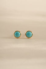 Gold turquoise stud earrings by Sami Jewels showing front view of vibrant turquoise stones on gold setting.
