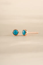 Sami Jewels turquoise stud earrings with rose gold setting, round gemstone design perfect for elegant jewelry styling.
