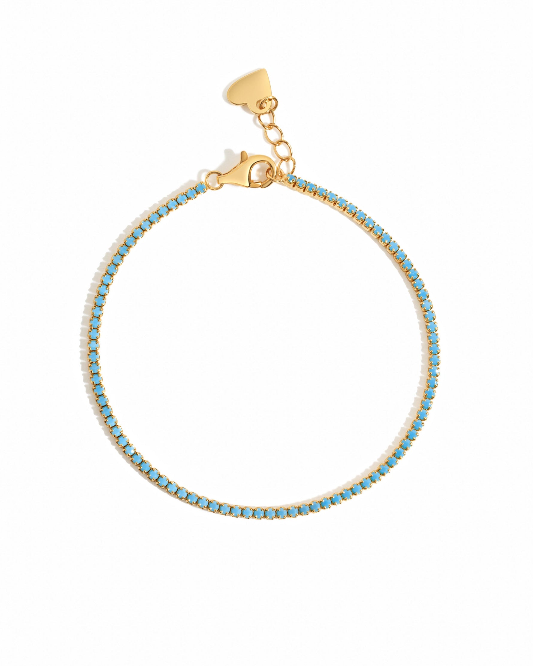 Turquoise tennis bracelet by Sami Jewels featuring vibrant turquoise stones set in gold on a white background.