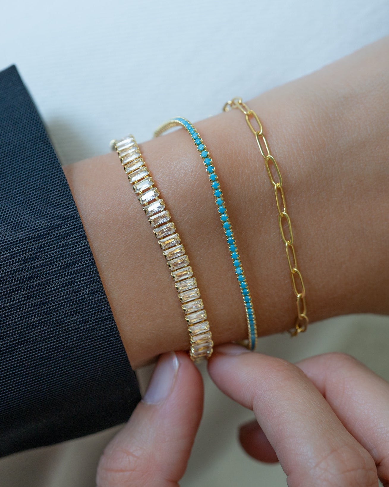 Turquoise tennis bracelet by Sami Jewels featuring a stack of vibrant turquoise stones set in gold.