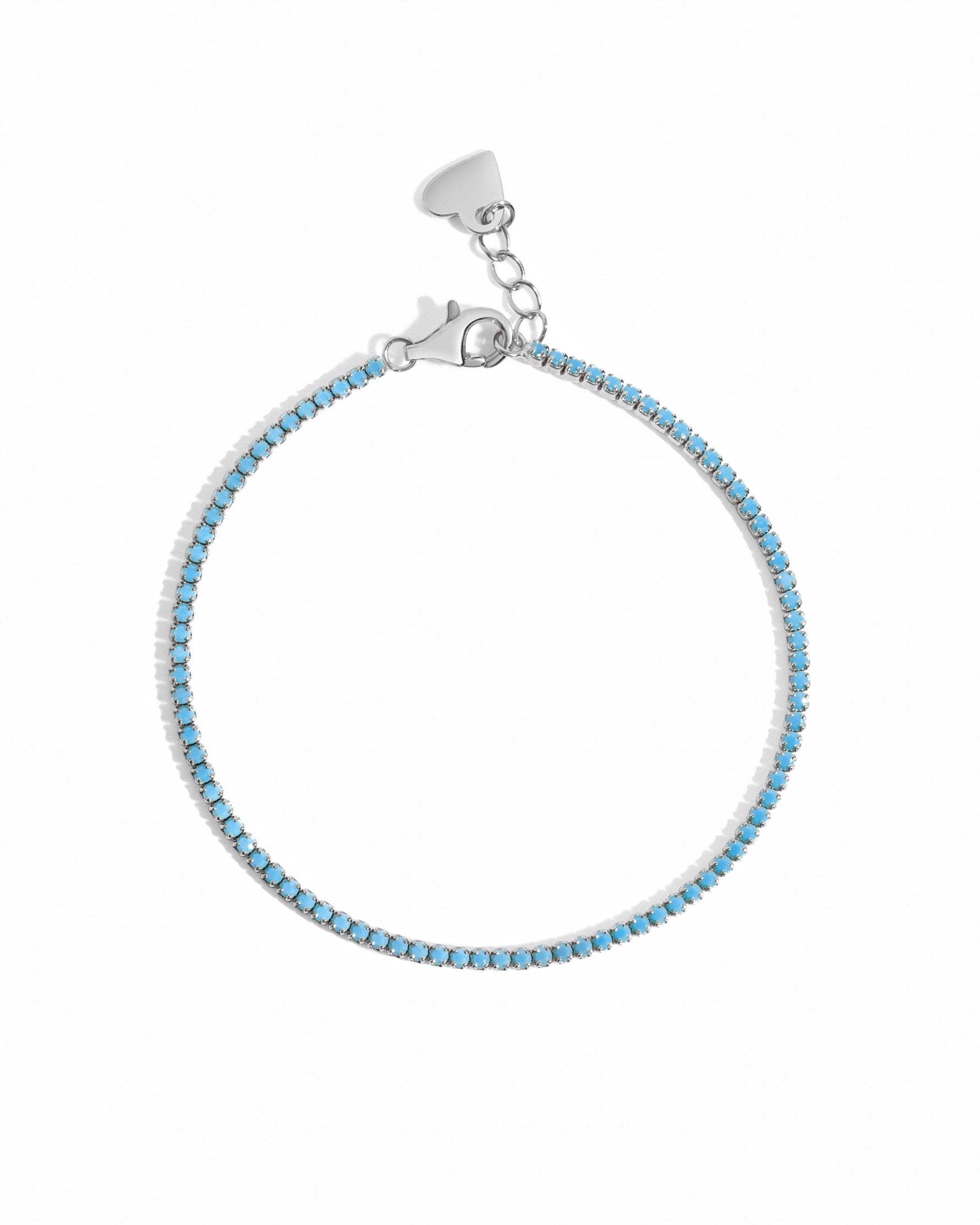 Turquoise tennis bracelet by Sami Jewels featuring sterling silver links on a white background.