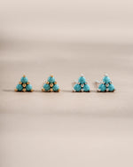 Turquoise three-stone stud earrings by Sami Jewels featuring gold and sterling silver settings.