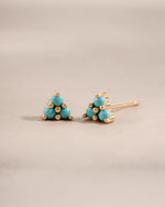 Gold turquoise three-stone stud earrings by Sami Jewels featuring vibrant blue turquoise stones set in elegant gold.
