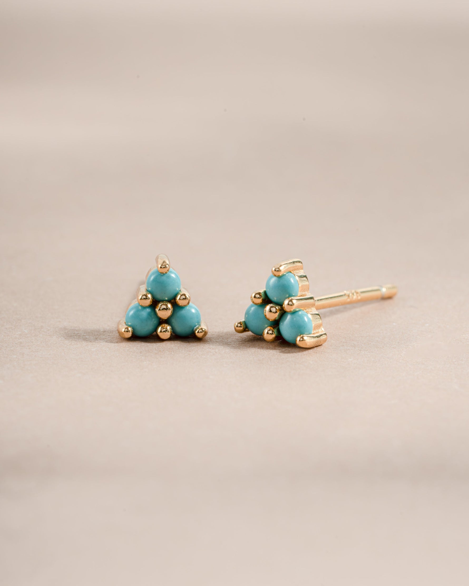 Gold turquoise three-stone stud earrings by Sami Jewels featuring vibrant blue turquoise stones set in elegant gold.