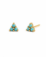 Turquoise three-stone stud earrings by Sami Jewels on a white background, showcasing gold settings and vibrant turquoise stones.