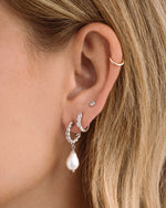 Sterling silver Spiral Pearl Drop Earrings with twisted hoop charm by Sami Jewels, featuring elegant pearl accents.