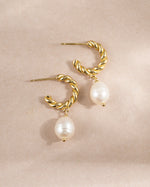 Gold spiral pearl drop earrings by Sami Jewels featuring twisted hoop design and elegant pearl charms.