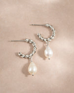 Sterling silver spiral pearl drop earrings by Sami Jewels featuring twisted hoops and elegant pearl accents.