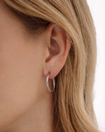 Silver stainless steel SS Twisted Hoops earrings by Sami Jewels, showcasing their twisted design and waterproof finish.