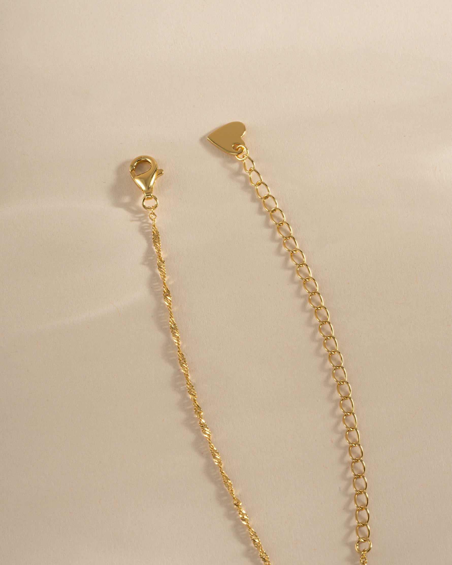 Gold twisted rope chain necklace with lobster clasp closure by Sami Jewels, showcasing a sleek, elegant jewelry piece.