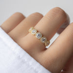 model wearing a cz ring with 5 stones and a halo