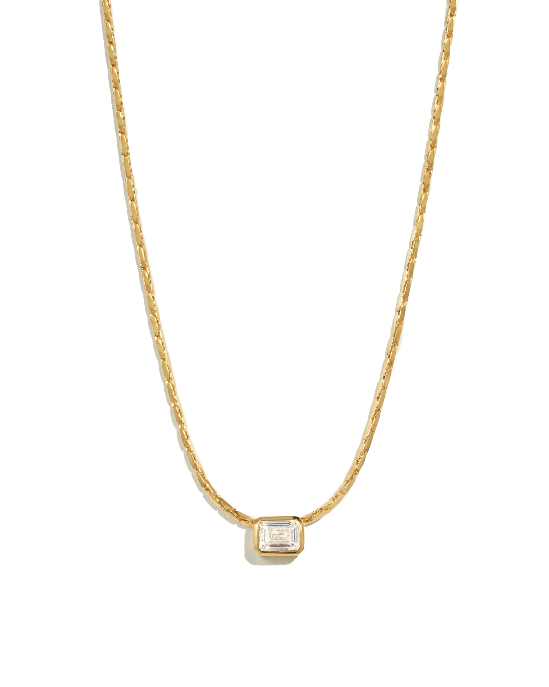 White CZ baguette bezel statement necklace by Sami Jewels featuring a bold gold chain and sparkling white cubic zirconia accents.
