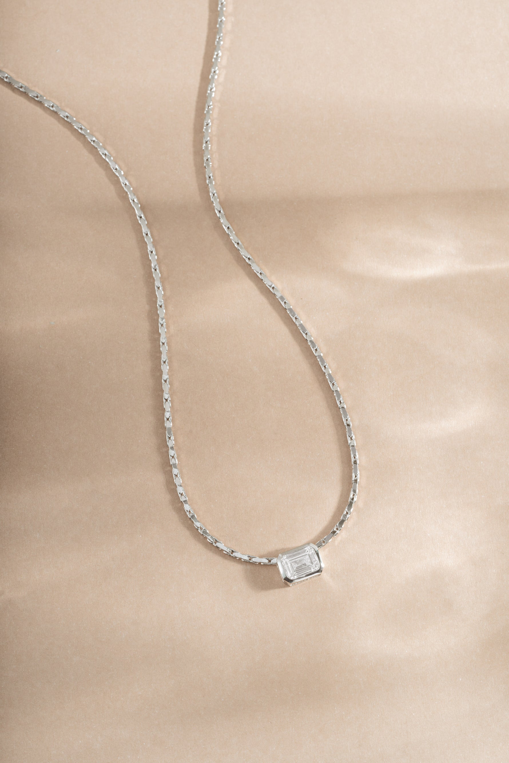 White CZ baguette bezel statement necklace by Sami Jewels featuring sterling silver chain and elegant design.