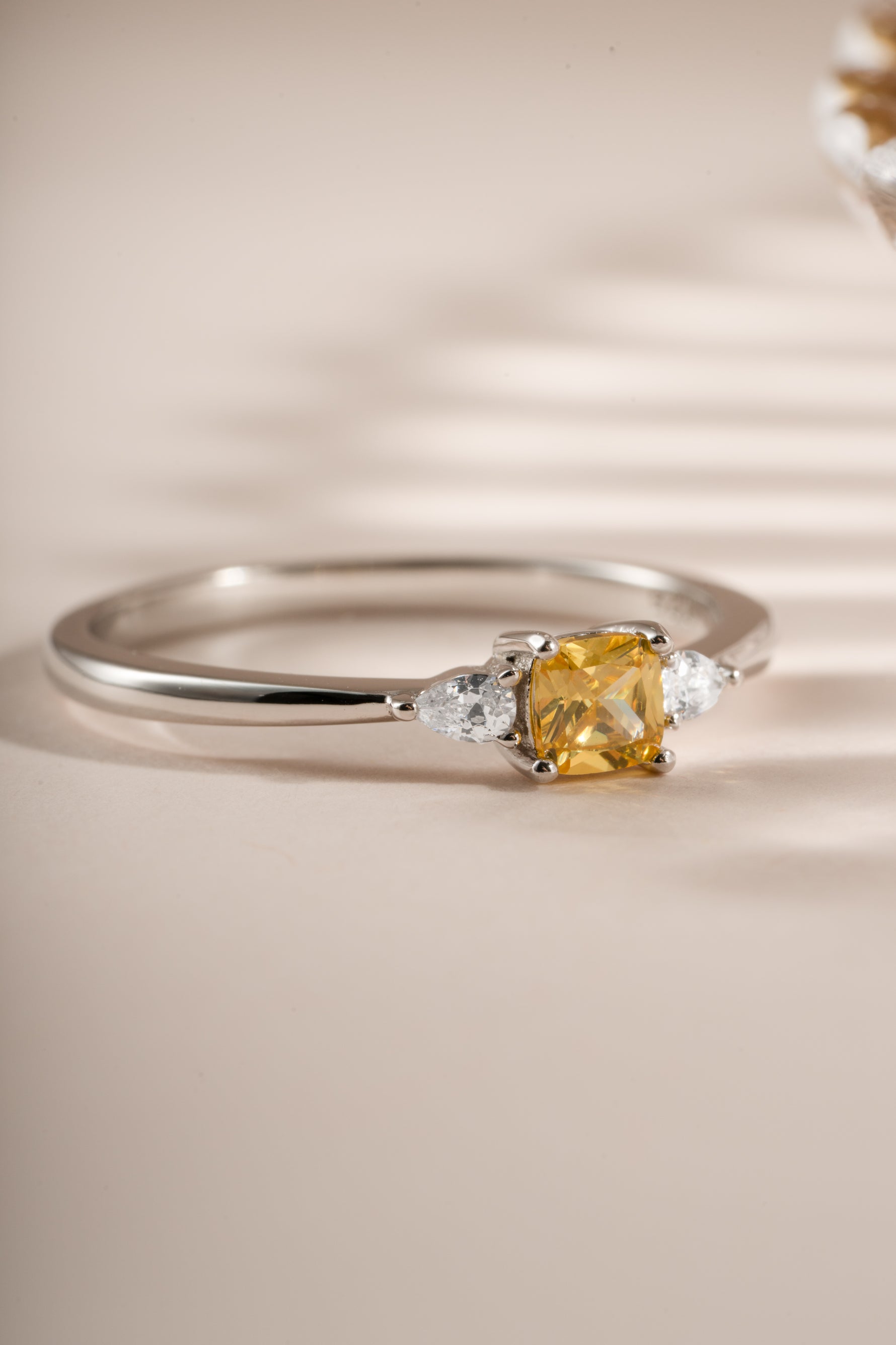 Close-up of Sami Jewels Citrine Cushion Ring featuring a vibrant yellow citrine stone set in sterling silver.