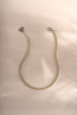 Yellow diamond tennis bracelet by Sami Jewels featuring sterling silver with a lobster clasp closure and sparkling diamonds.