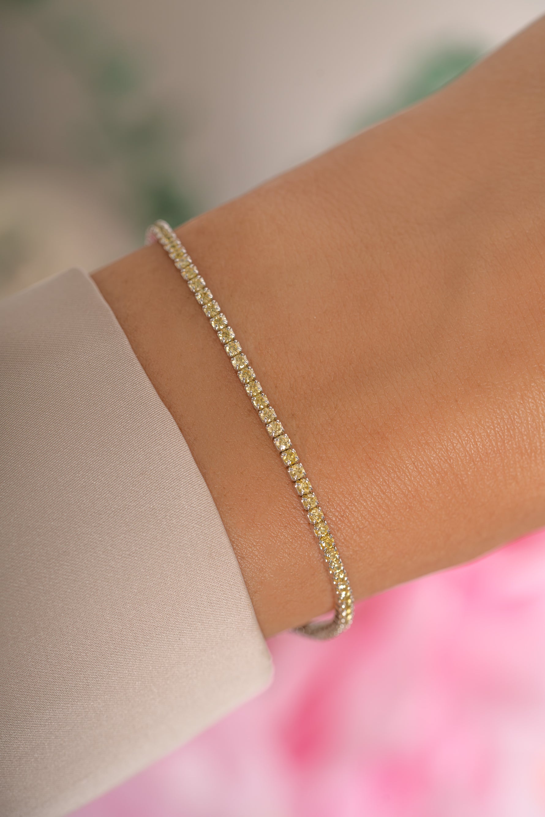 Yellow diamond tennis bracelet by Sami Jewels featuring sterling silver setting with sparkling stones on a delicate chain.