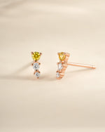 Yellow and diamond ear climber earrings in rose gold by Sami Jewels, featuring a sleek, curved design for elegant ear embellishment.