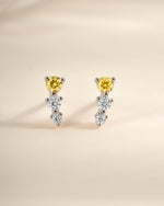 Yellow and diamond ear climber earrings by Sami Jewels, featuring sterling silver design with sparkling yellow accents.