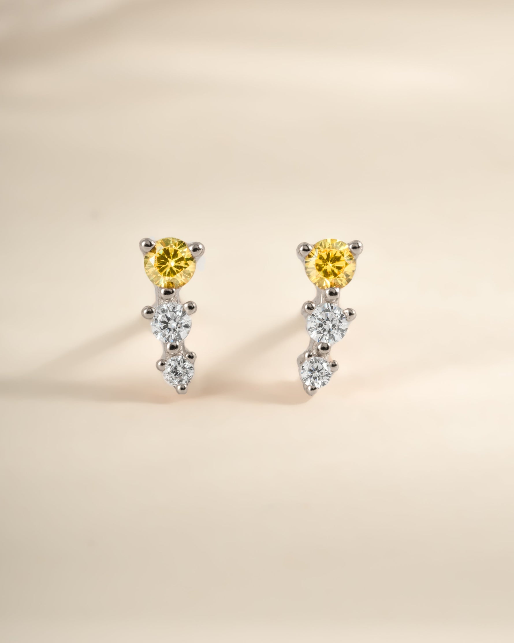 Yellow and diamond ear climber earrings by Sami Jewels, featuring sterling silver design with sparkling yellow accents.