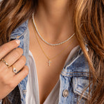 a close up of a person wearing a necklace