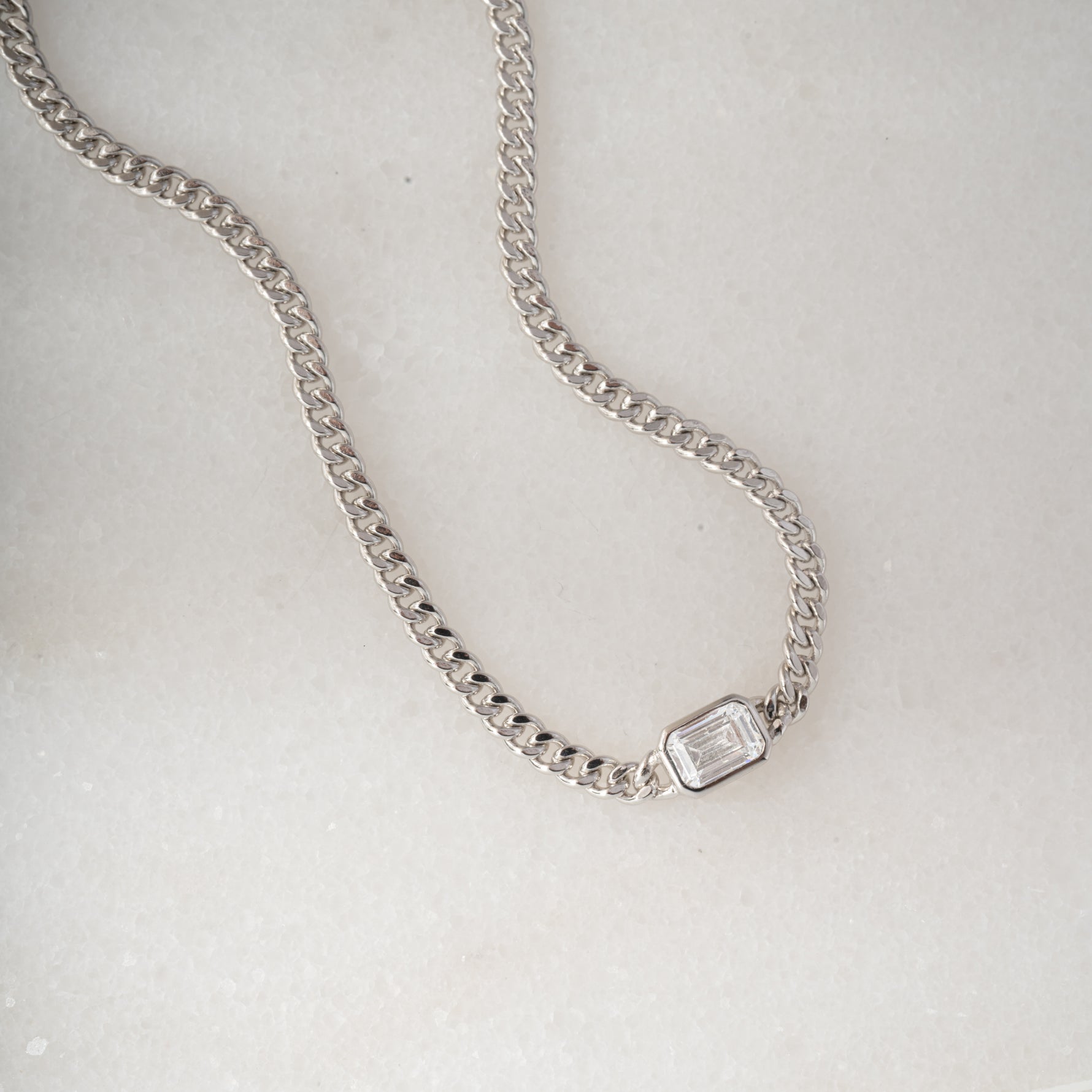sterling silver curb chain bracelet with diamond baguette charm