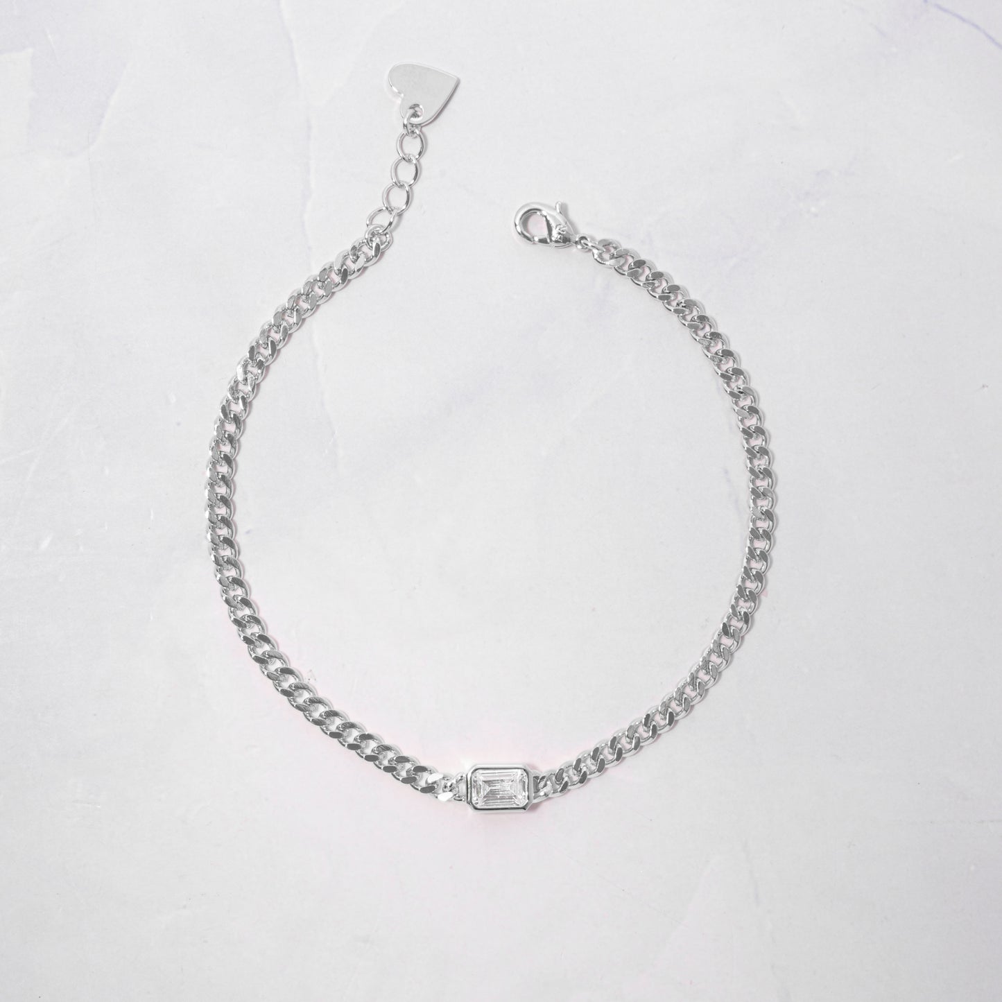minimalist sterling silver curb chain bracelet with diamond bezel baguette charm