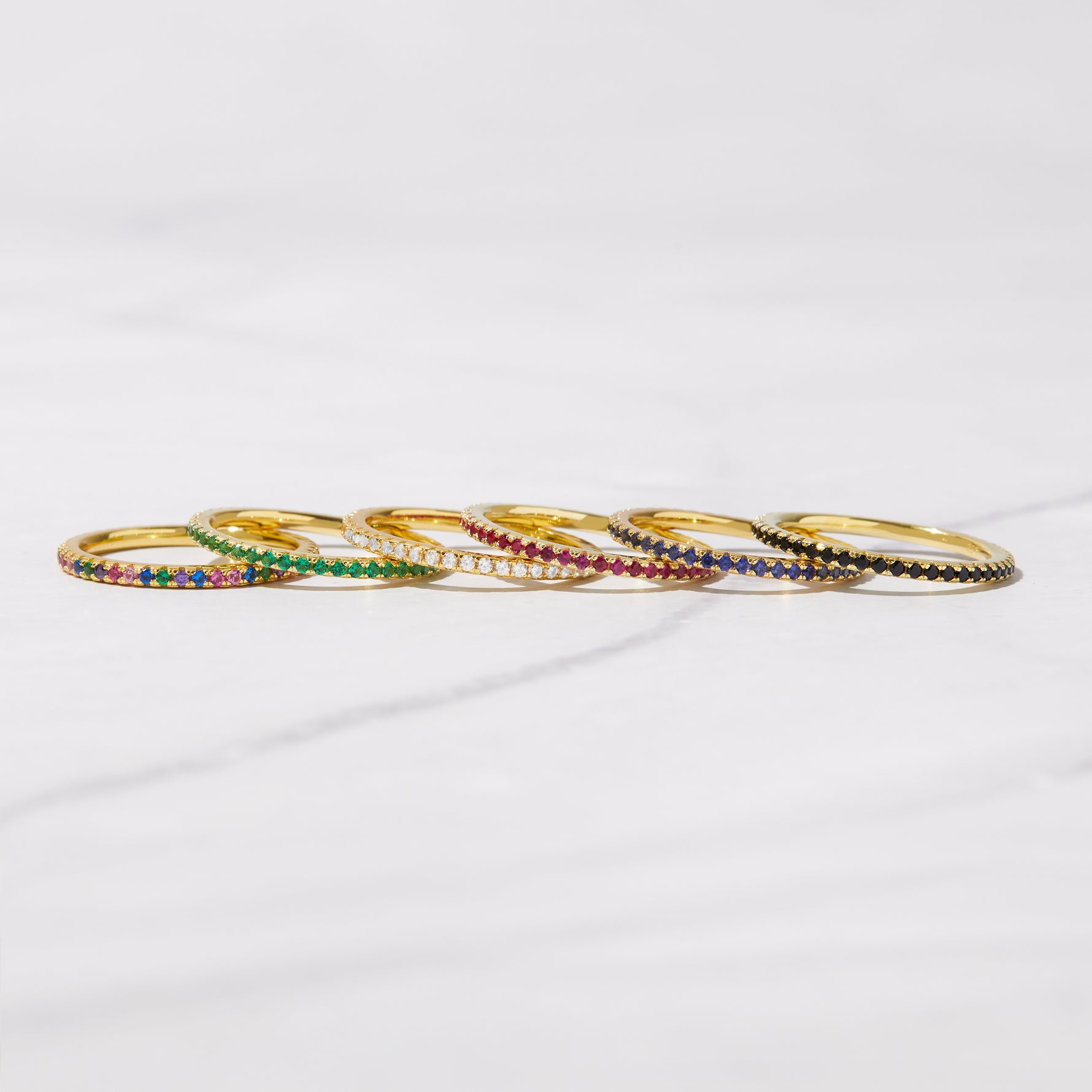 range of colors of dainty thin cz eternity bands from Sami Jewels 