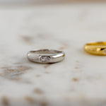 Sterling silver dome ring in soft studio lighting. 