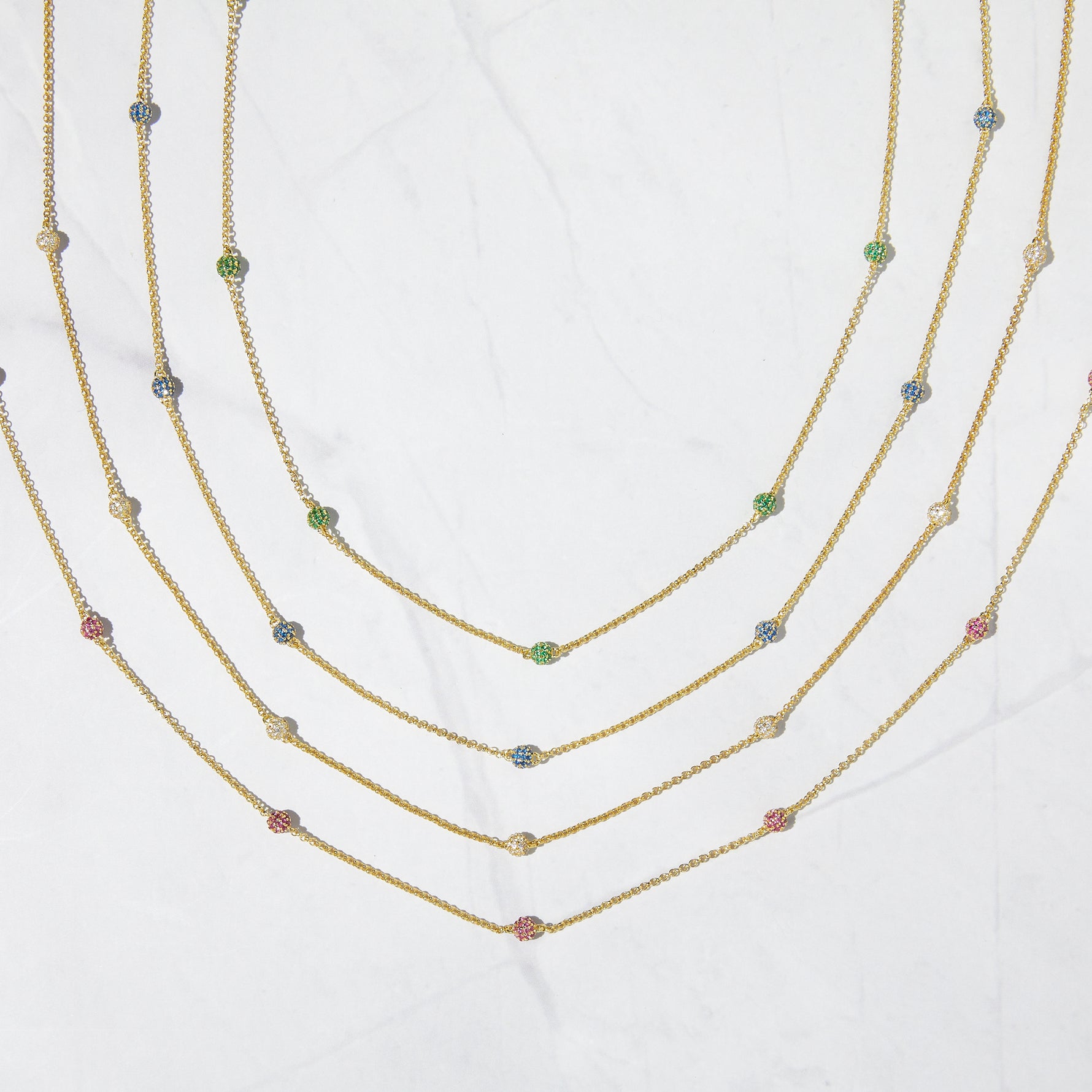 Birthstone ball beaded necklaces in emerald, ruby, and diamond. 
