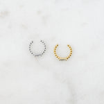 Dainty gold and silver beaded adjustable ear cuffs with baguette cz stones on them.