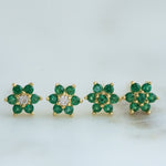 Gold emerald flower stud earrings in two different variations. 