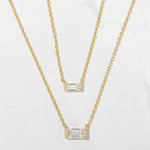 Simple gold baguette pendant necklaces in a small and a medium size. 