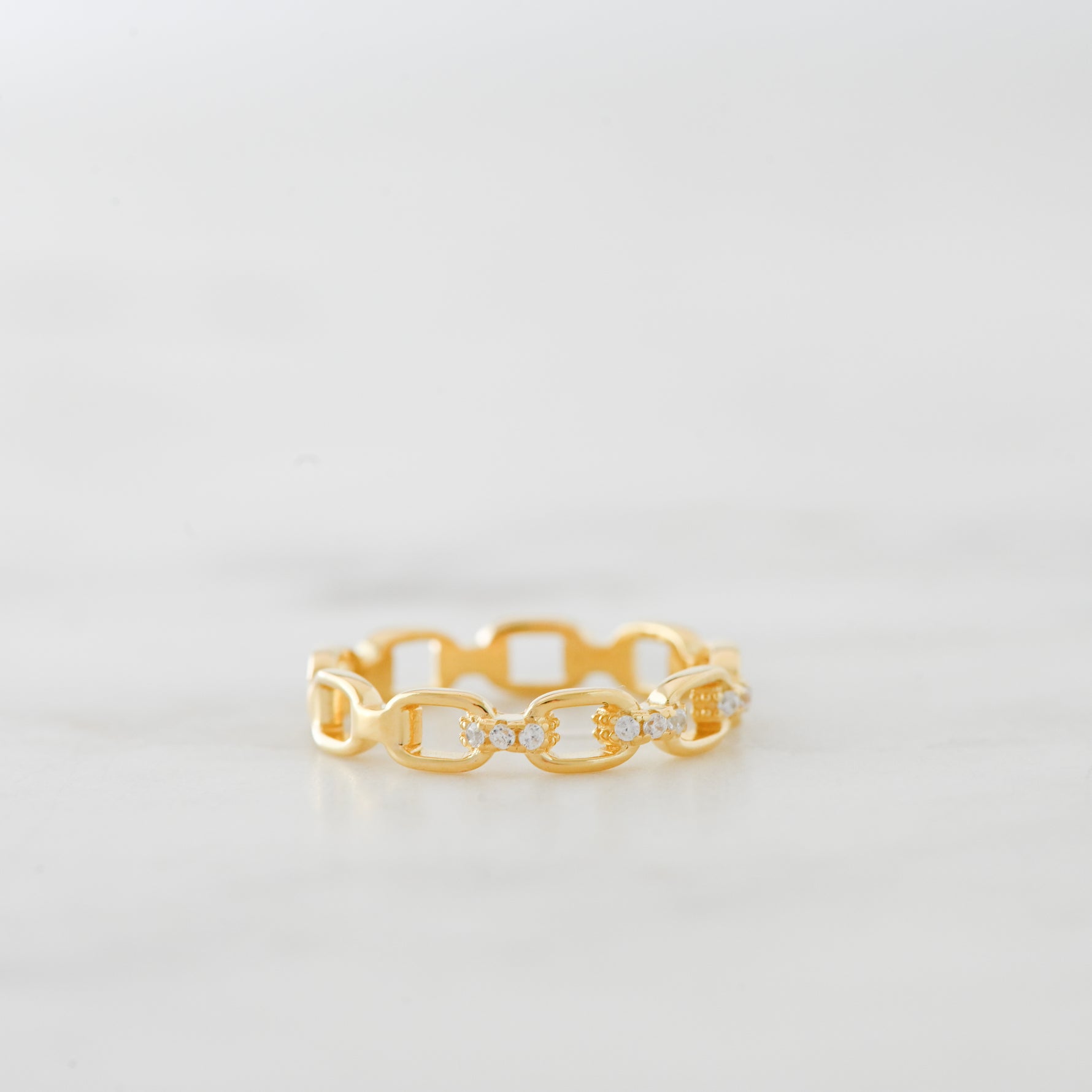 Gold link chain ring with CZ detail. 