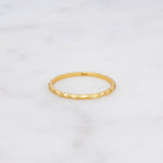 Upclose shot of 925 sterling silver 14k gold plated hammered textured ring.