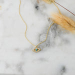 Gold boho chic turquoise evil eye pendant necklace. 