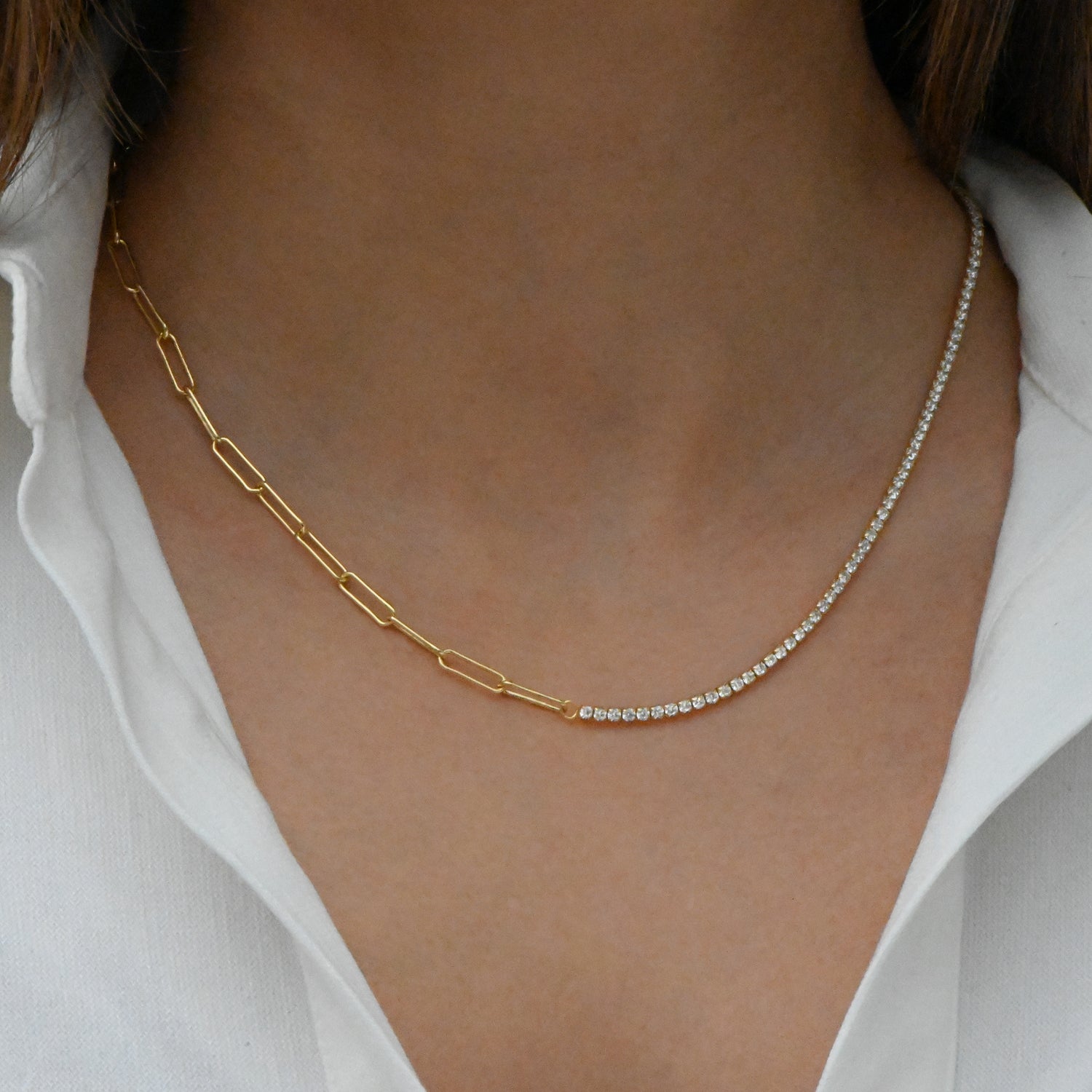 Model wearing unique half tennis half paperclip chain necklace.