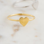 Upclose image of gold plain heart ring.
