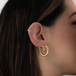 Madison Beer gold hoop earrings. 