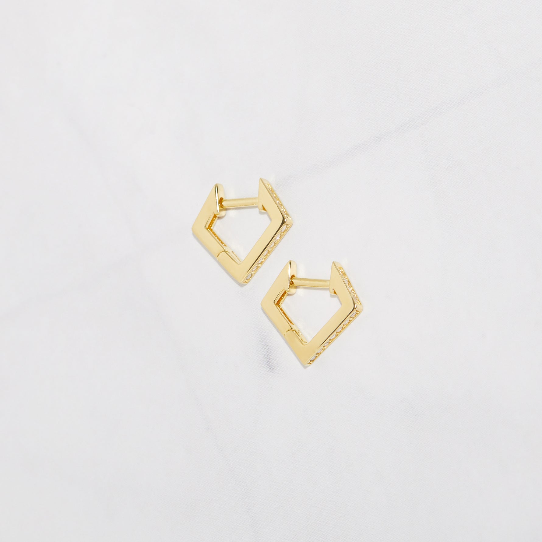 Tiny studded gold geometric huggie earrings. 