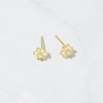 Gold opal birthstone stud earrings from the top angle.