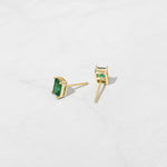 Green emerald cut stud earrings.