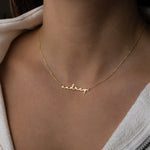 Model script minimalist name necklace in gold
