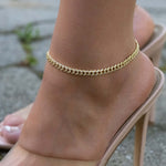 Model wearing statement cuban link diamond ankle bracelet