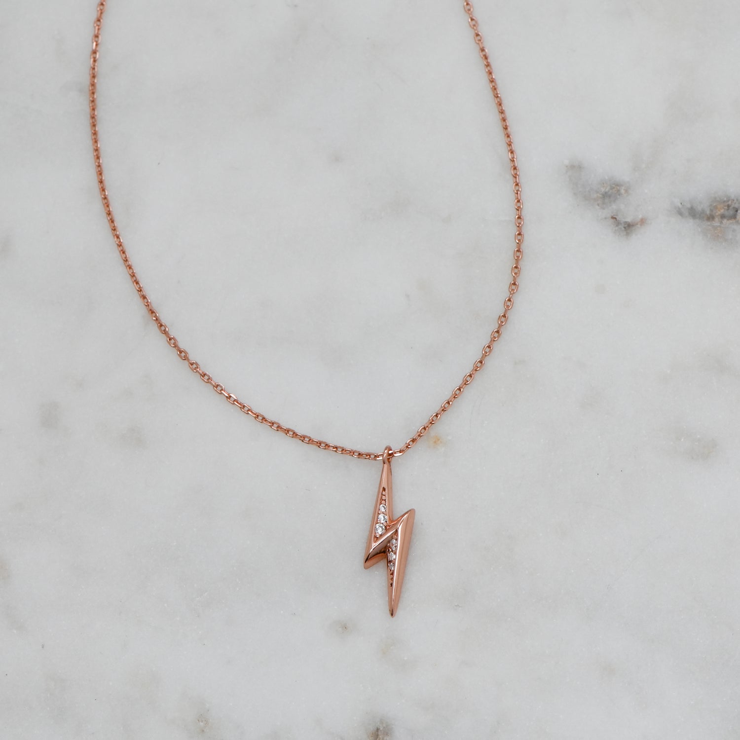 Rose gold dainty lightning bolt pendant necklace.