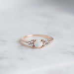Rose gold stacking ring with opal center stone and cz diamonds. 