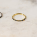 Delicate gold eternity sapphire ring.