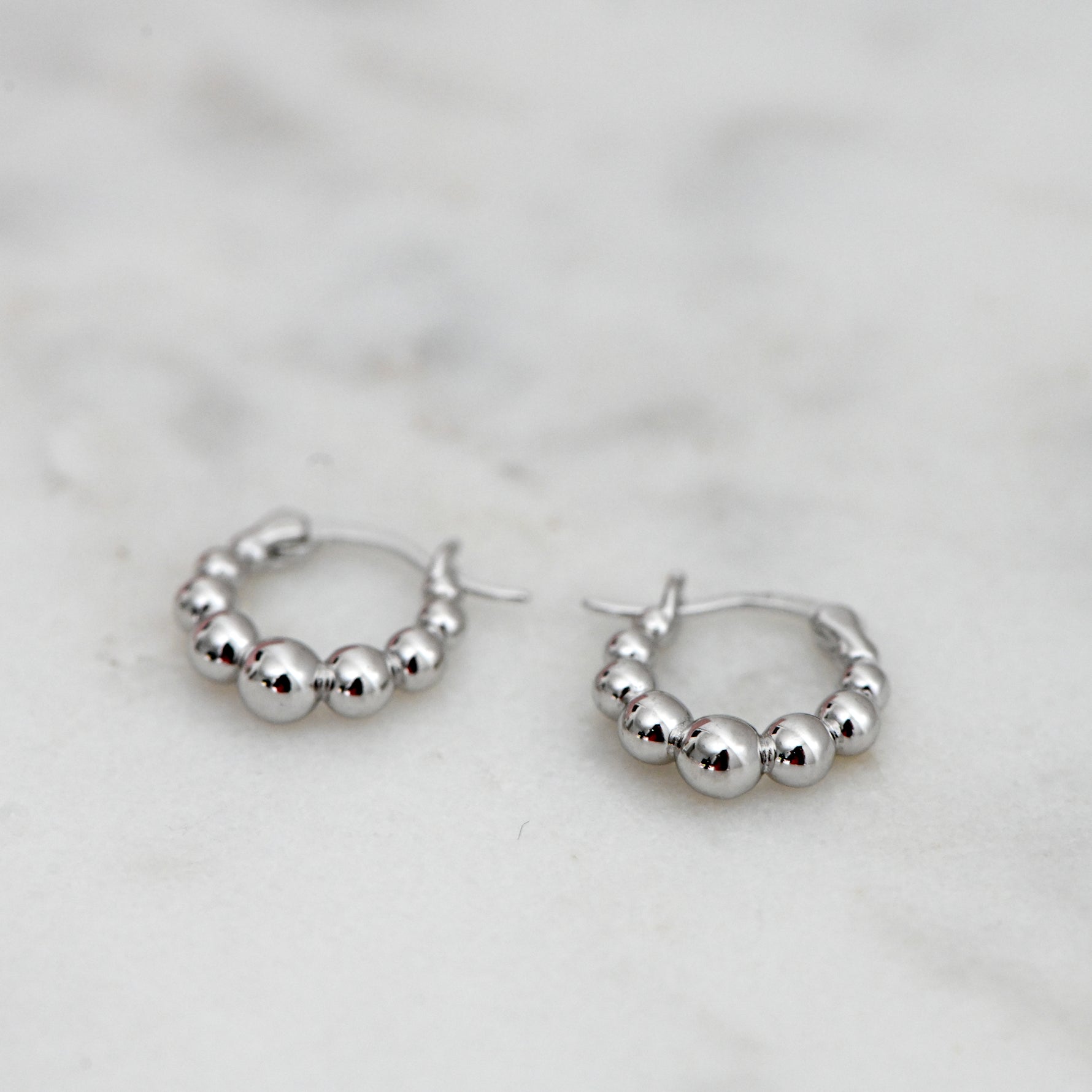 Silver beaded gradient hoop earrings