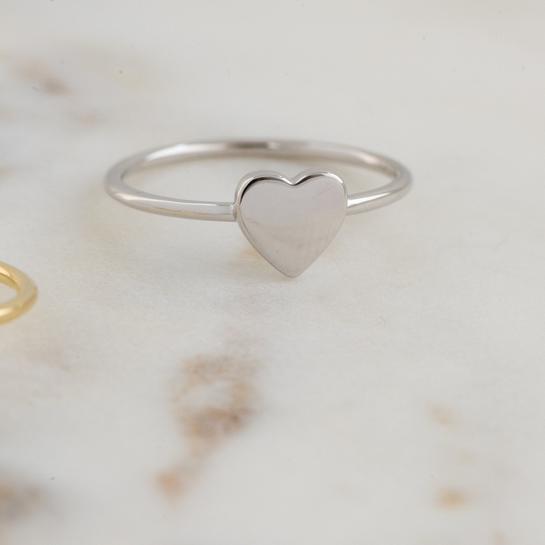 Upclose image of 925 sterling silver plain heart ring.