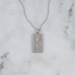 Silver medallion rose rectangle pendant necklace. 